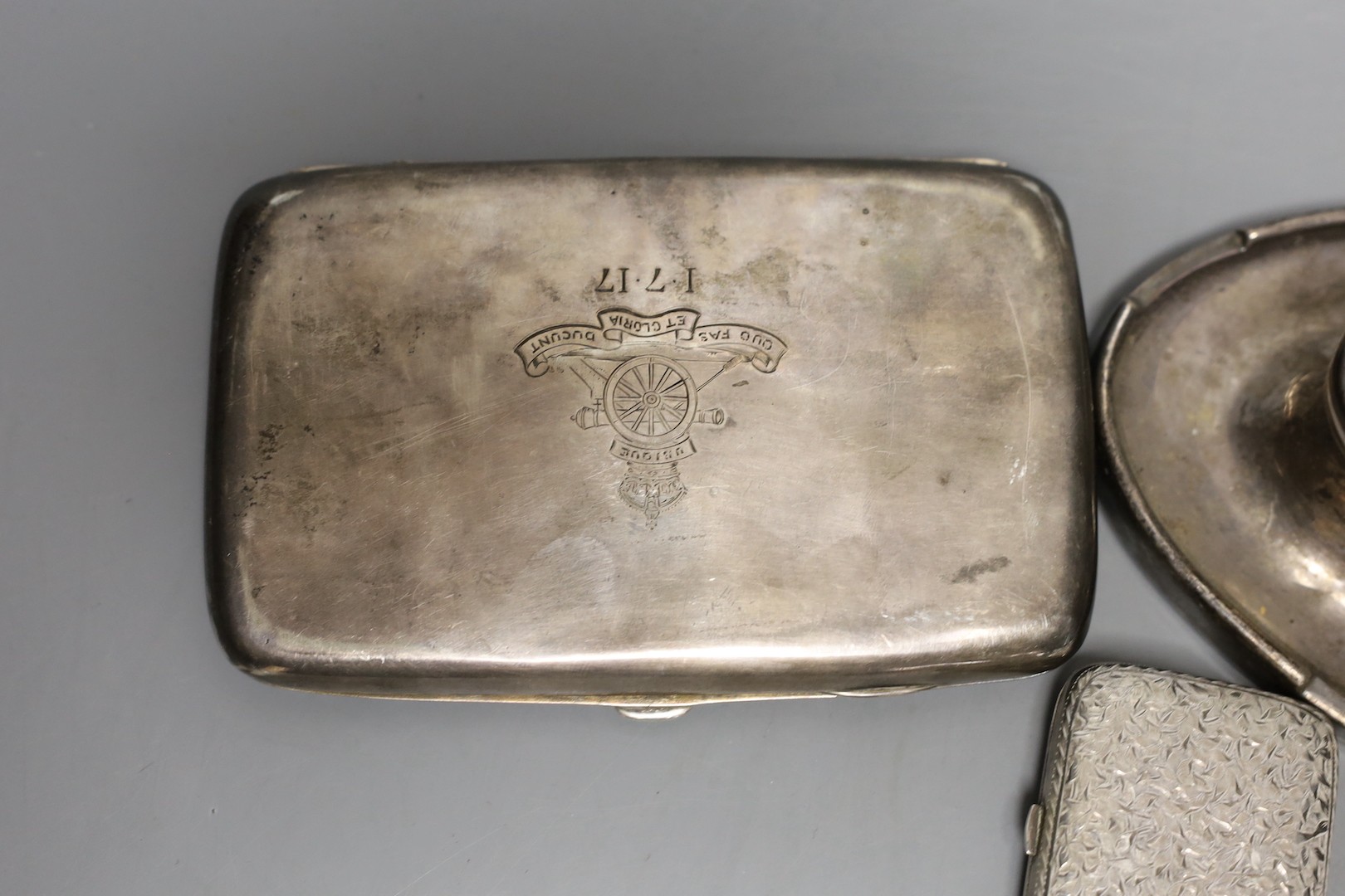 A George V silver double oval inkwell, with engraved inscription, Birmingham, 1913, 20.3cm, a silver cigarette case and a small late Victorian silver purse.